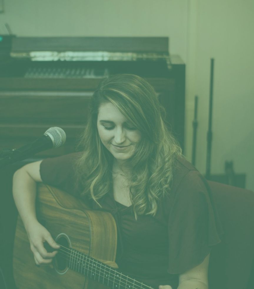 Emily playing guitar